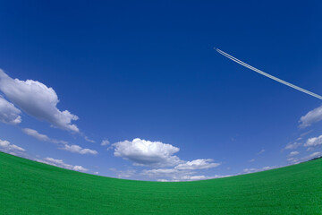 草原と飛行機雲
