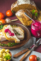 Tasty baking pork lard bacon fatback with black pepper and other herbs and spices in ceramic dish. Traditional Ukrainian, Hungarian, Polish or other Eastern Europe national dish