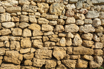 Texture of old wall of ancient city is made of stone wall 