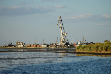 Fototapeta na wymiar View of the harbor crane from afar