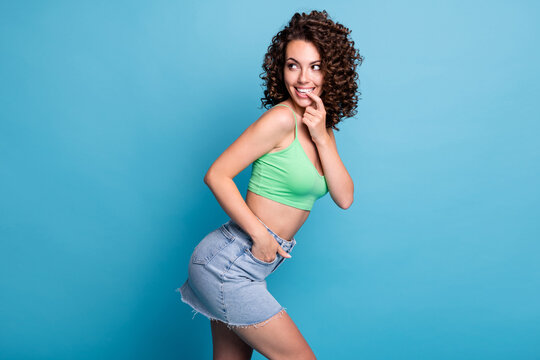 Profile photo of cute nice coquette lady model look empty space bite nail great discount sales products want buy get present wear green top jeans skirt isolated pastel blue color background