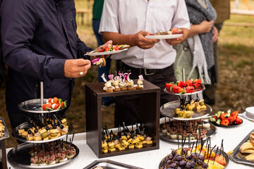 A set of canapes and snack at a banquet with white table