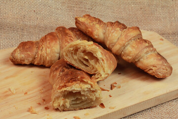 crissant on a wooden chopping board
