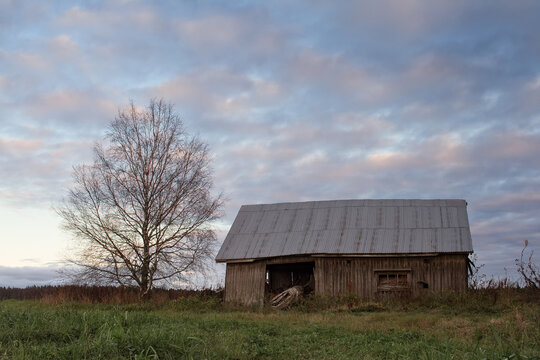 Old Barn House in the Autumn Sunset
