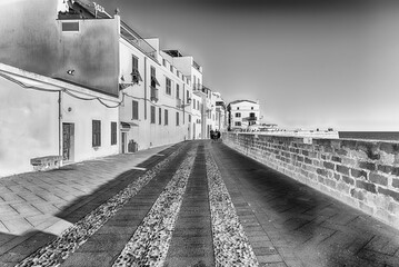 Walking on the historic ramparts in Alghero, Sardinia, Italy