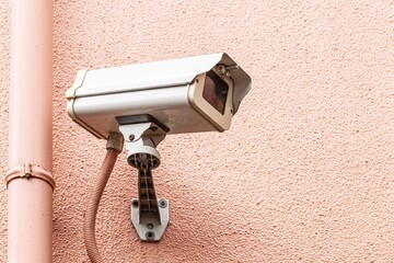 Video camera security system on the wall of the building