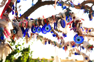 Blue eye-shaped amulets made of blue glass. Devil eye charm to protect against the bad energy in Goreme Cappadocia, Turkey.