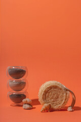 Eco-friendly loofah scrubber and clay for face mask in glass bowls. 