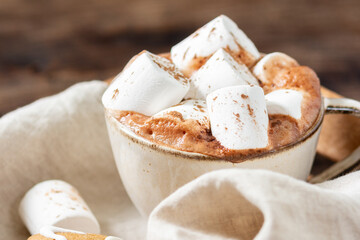 Hot cocoa or hot chocolate with marshmallows in a ceramic Cup on a white background	