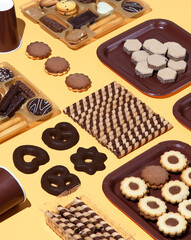 Chocolate cookies mix and plastic cap background. Winter holiday time. Minimal still life art. Christmas holiday concept