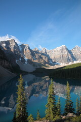 View of The Moraine Lake with snow covered mountain peaks during summer in Banff National Park, Canadian Rockies, Alberta, Canada.