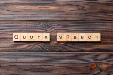 quote speech word written on wood block. quote speech text on cement table for your desing, concept