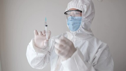 sheltered doctor taking the air in the syringe - Powered by Adobe