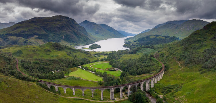 Aerial view of Glenfinnan viaduct with loch Shiel and montains in the background