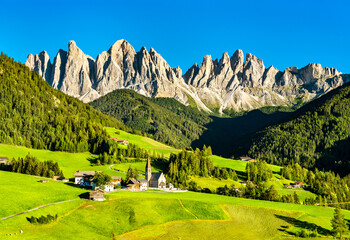 View of Val di Funes with the Chruch of Santa Maddalena in the Dolomites Mountains. UNESCO world...