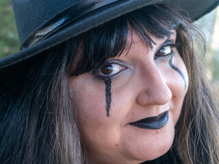 Woman posing in disguise for Halloween in a forest