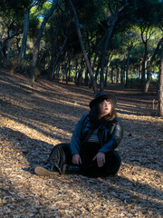 Woman posing in disguise for Halloween in a forest