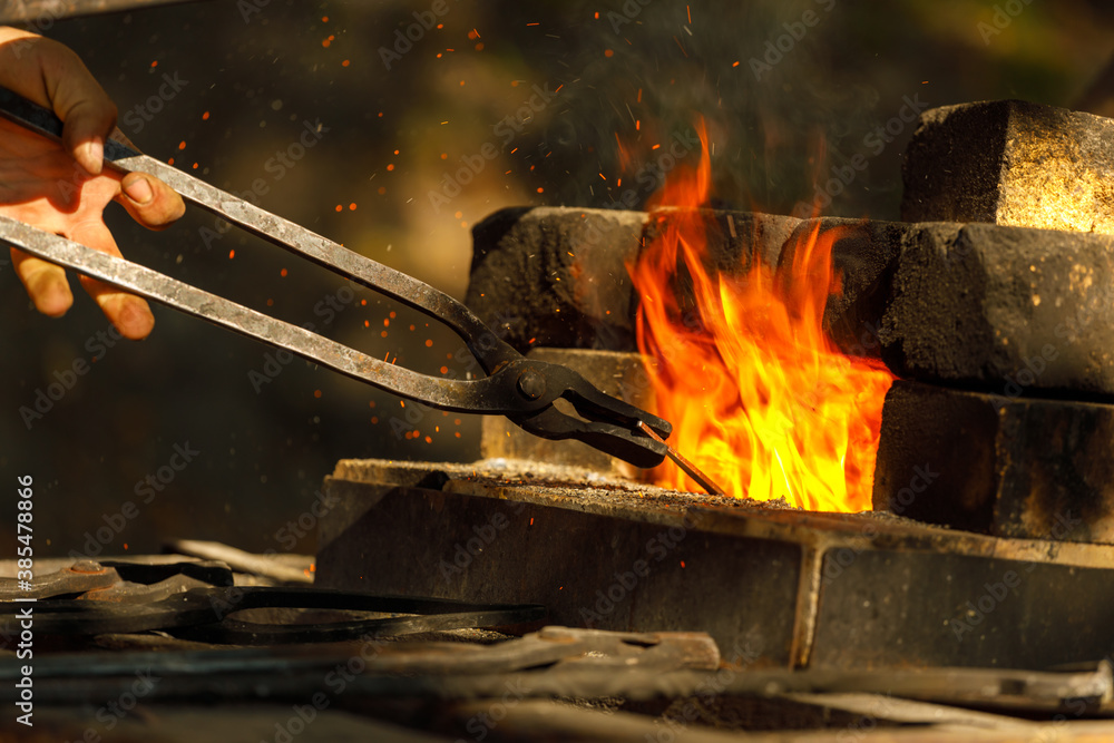 Poster a burning forge made of bricks in nature