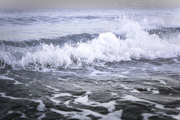Sea beach water with waves. Stormy sea waves, beautiful seascape, forces of nature, natural disaster. Sea with Waves Details.