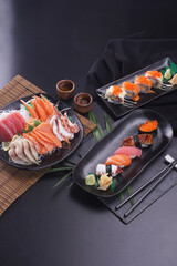 Sashimi and sushi Japanese food set. Salmon, Ikura, wasabi, fish, shrimp and tuna.