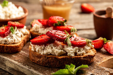 Healthy breakfast toasts with cheese ricotta blueberries, strawberries, raspberries