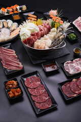 Shabu Shabu or Sukiyaki, a popular dish of pork, beef, shrimp, squid, seafood and fresh vegetables. Placed on a table with a boiling pot boiling.