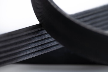 New belt for automobile poly-V-belt electricity generator. Macro close-up blank for background