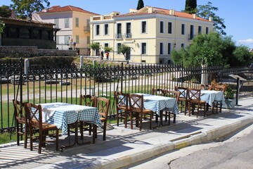 Greece, Athens, October 9 2020 - Empty chairs and tables of a traditional restaurant in the touristic district of Plaka.