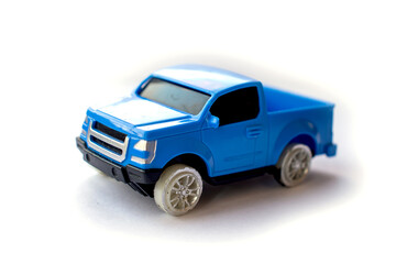 Children’s toy little blue car on a white background.