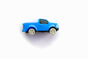 Children’s toy little blue car on a white background. Copy space for text