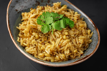 Kichari decorated with parsley leaves close-up