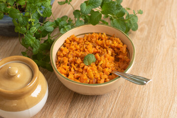 Carrot sabzi , Gajar  sabji , vegetable stir fry with grated coconut Carrot Thoran South Indian Cuisine Kerala India.   wooden background