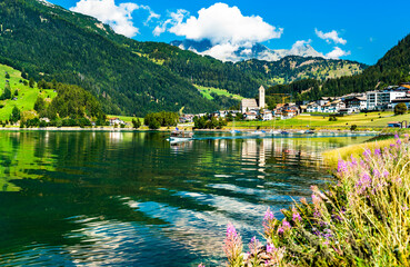 Fototapeta na wymiar Reschen am See or Resia, a village on Lake Reschen in South Tyrol, Italian Alps