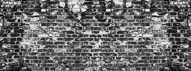 Grunge black brick wall background texture