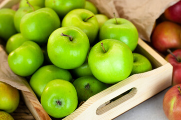 Different types of apples on a market table. Fresh harvest of green apples, farm organic fruits