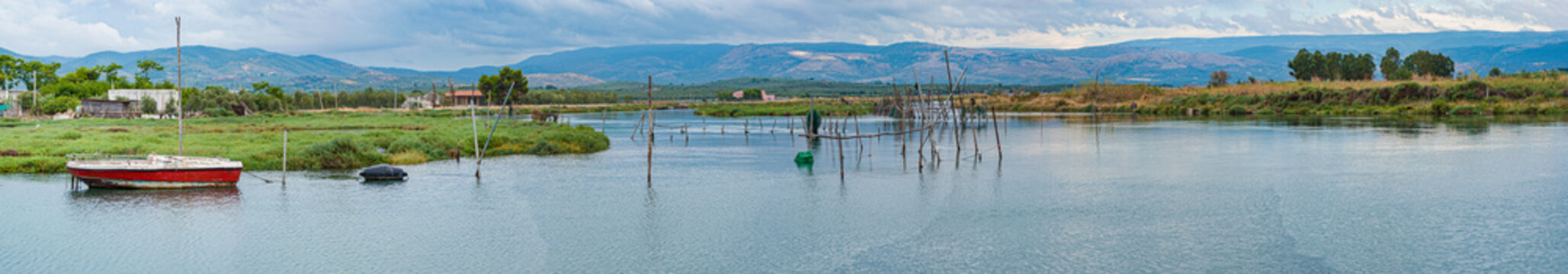 View of Lake Lesina with the structures of a fish farm in the foreground. Apulia - Italy