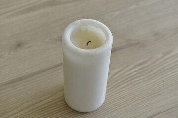 White candle on a wooden table