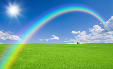 Naklejka premium 草原の赤い屋根の家と雲と虹と太陽