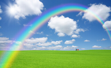 草原の赤い屋根の家と雲と虹と太陽