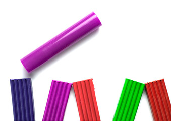 Fototapeta premium different colors of plasticine lie on a white board next to a gurney