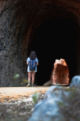 Woman walking in a cavern