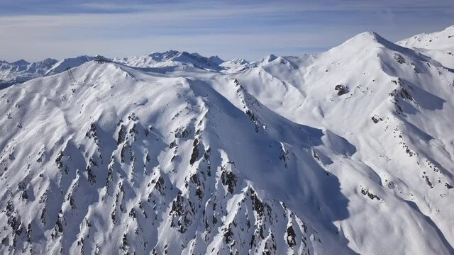 Aerial view of ski slopes in Horberg area, Mayrhofen ski, Tyrol, Austria. Speeded up from 24 fps. 2.5x speeded up from 24 fps.