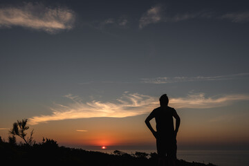 Silhouette of a man at sunset on the beach