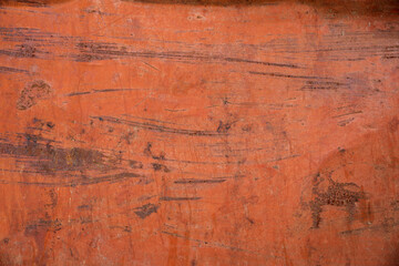 Texture of orange paint with rust on old iron. Background.