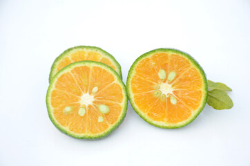 sliced orange fruit isolated on white background.
