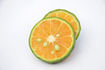 sliced orange fruit isolated on white background.