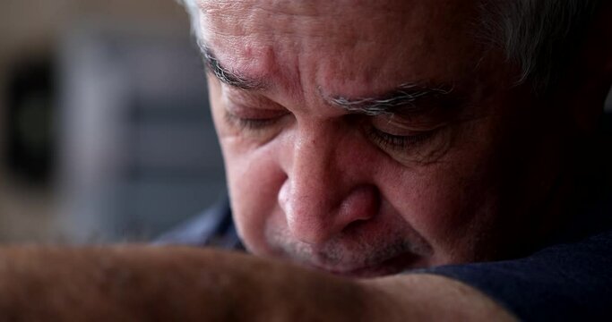 Depressed older man crying. Person in crisis. Middle-aged senior in despair