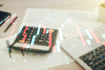 Abstract virtual crisis chart illustration on calculator and laptop background. Global crisis and bankruptcy concept. Multiexposure