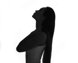 silhouette portrait of a beautiful caucasian girl, white background, studio photo