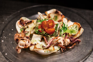 Grilled squid with lettuce and cherry tomatoes